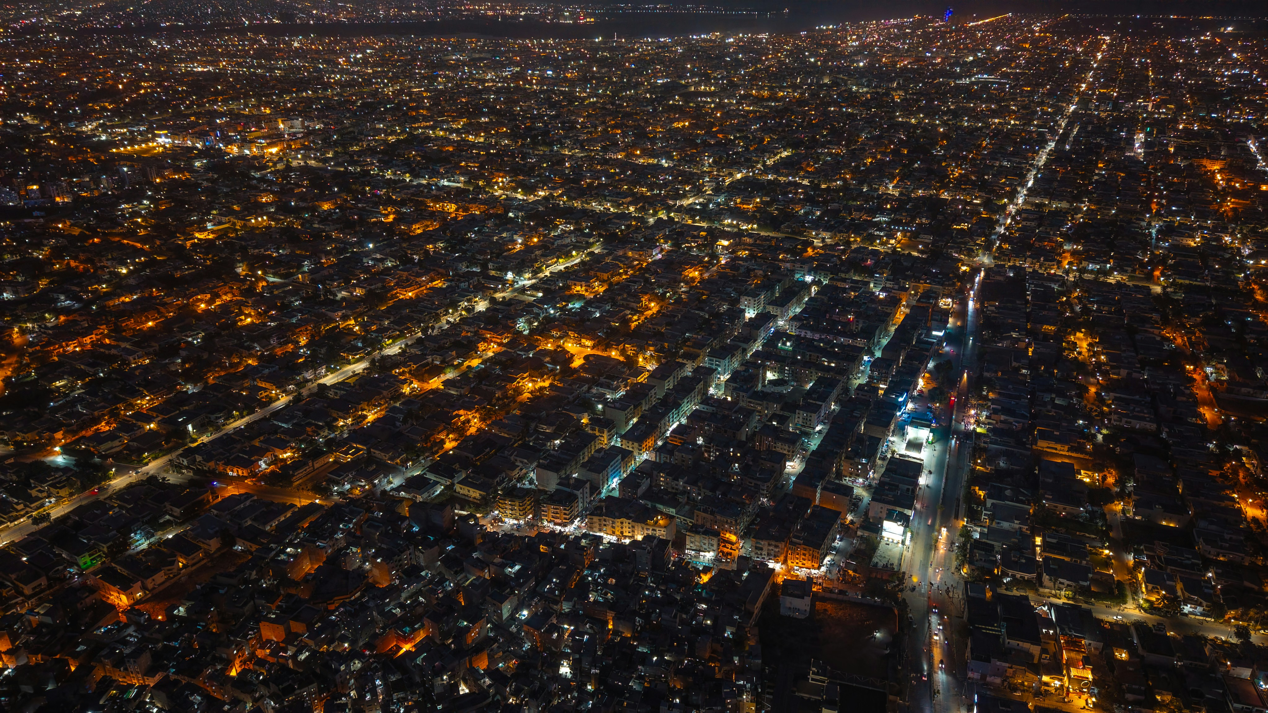 Aerial city grid at night